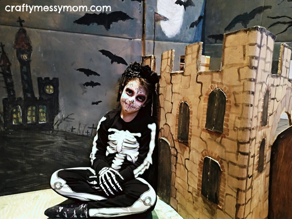 Giant pop-up castle and skeleton costume at craftymessymom.com