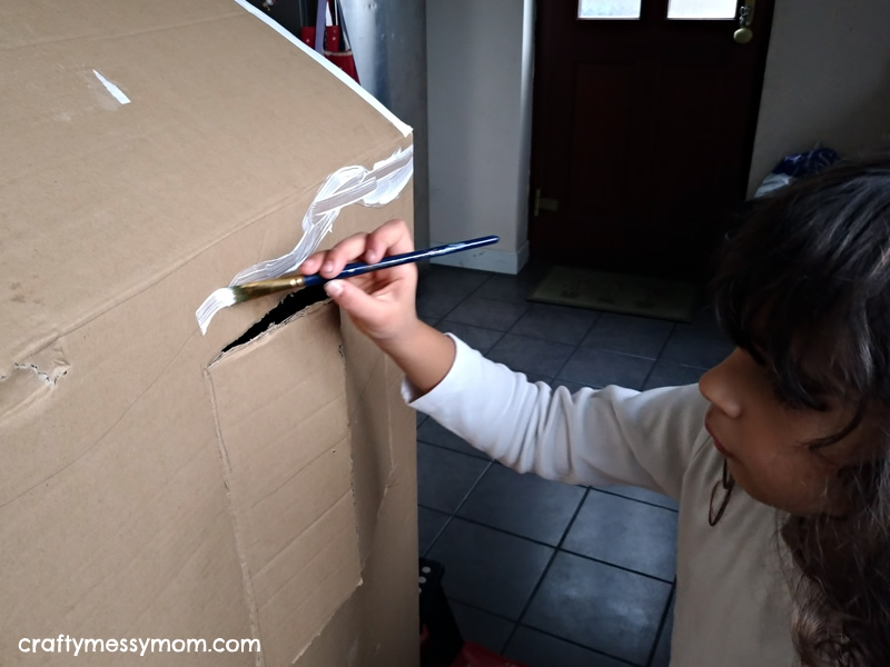 Christmas crafts - making a giant cardboard gingerbread house at craftymessymom.com