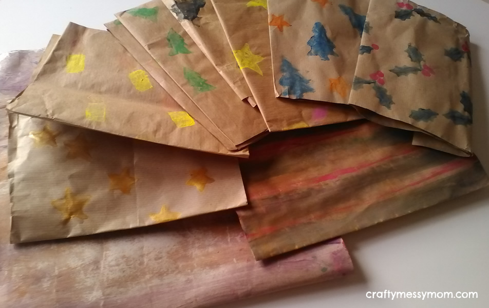 Christmas crafts - diy wrapping paper with potato stamps at craftymessymom.com