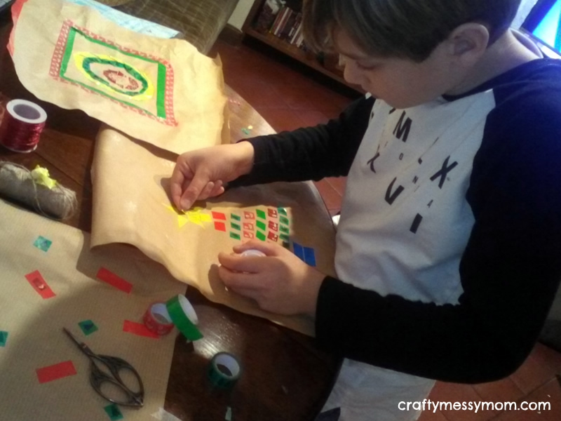 Christmas crafts - diy wrapping paper with washi tape at craftymessymom.com
