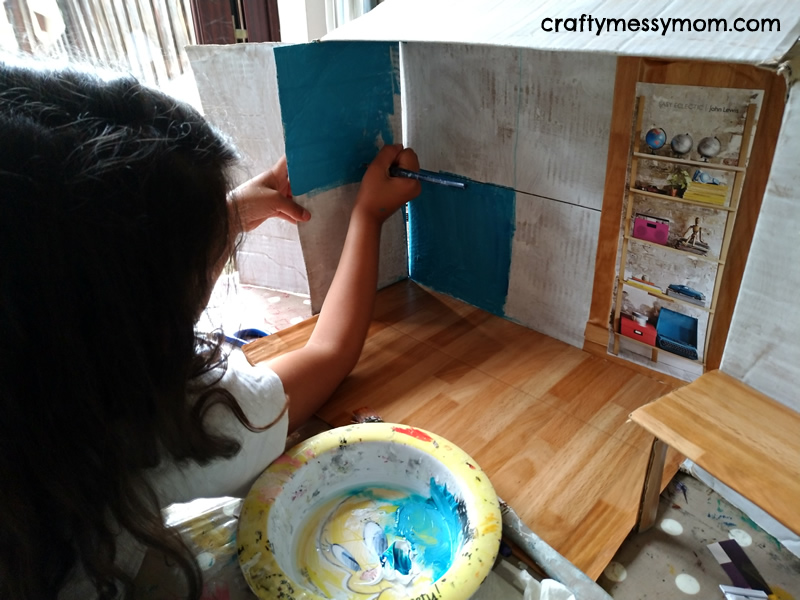 Cardboard convertible studio flat for Barbie - painting at craftymessymom.com